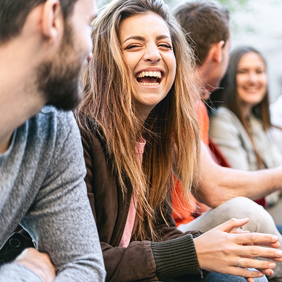 Patient in Fort Worth smiling with friends