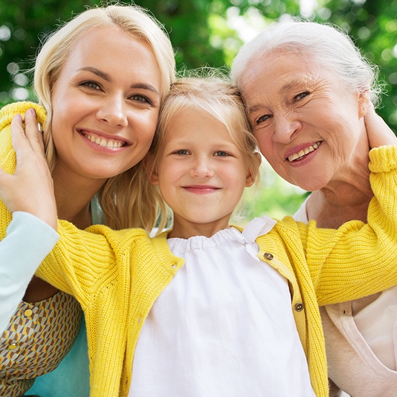 Three generations of women smiling together