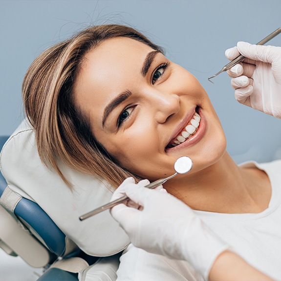 Woman sharing smile after tooth colored filling treatment