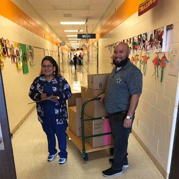 Dental team members delivering donations