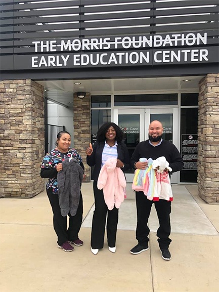 Three dental team members volunteering at The Morris Foundation Early Education Center