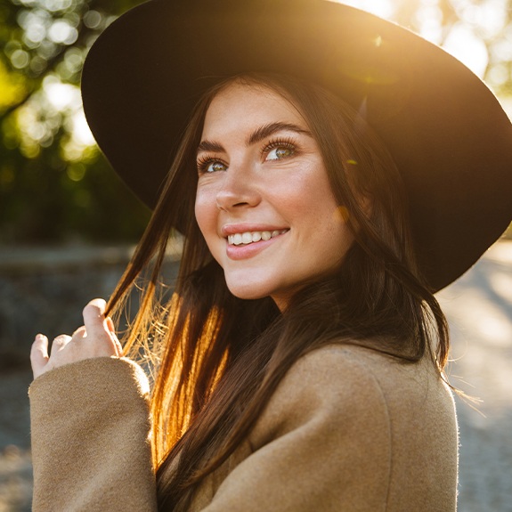 Woman sharing flawless smiles after cosmetic dentistry