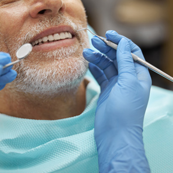 Closeup of patient smiling during exam
