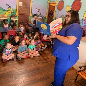 Dental team member donating toys to a charitable organization