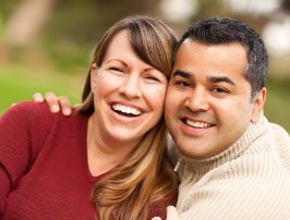 Woman and man with attractive smiles after cosmetic dentistry