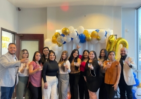 Five dental team members at community event