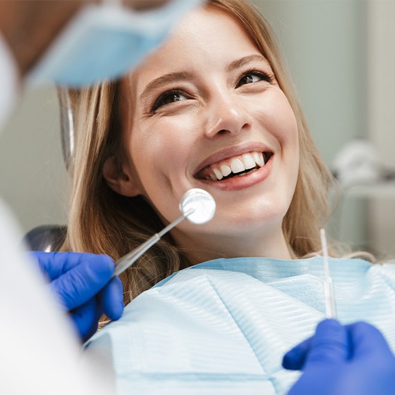 Woman smiling during preventive dentistry visit