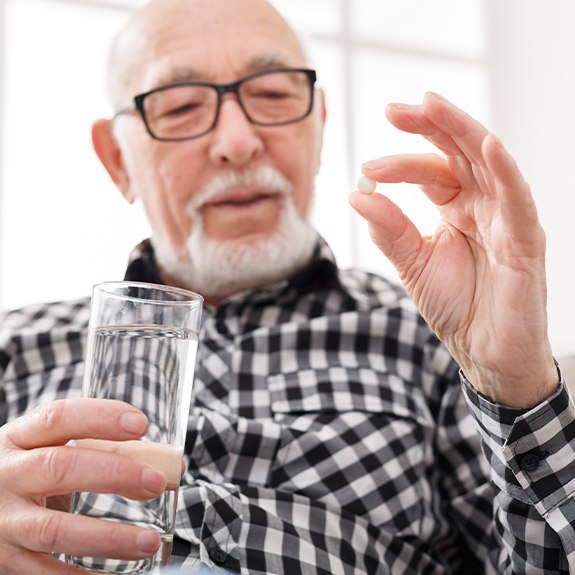 Man taking oral conscious dental sedation pill