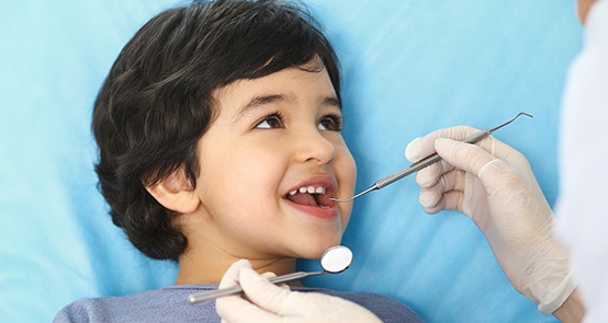 Young patient smiling during children's dentistry visit