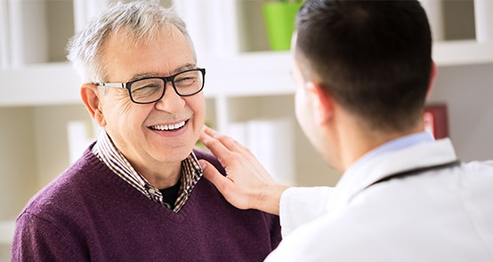 Older man with healthy smile after replacing missing teeth