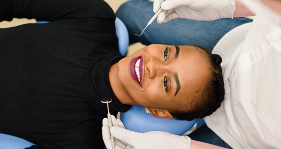 Woman with healthy smile after periodontal therapy