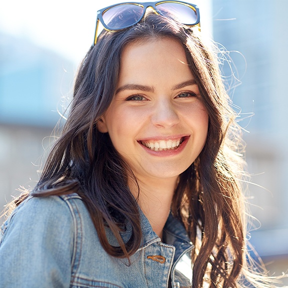 Young woman sharing healthy smile after wisdom tooth extractions