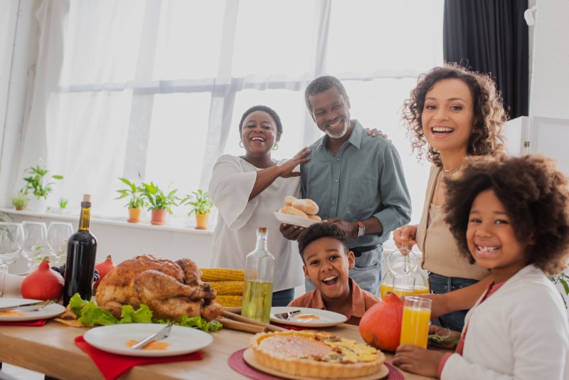 A family enjoying Thanksgiving with good dental health