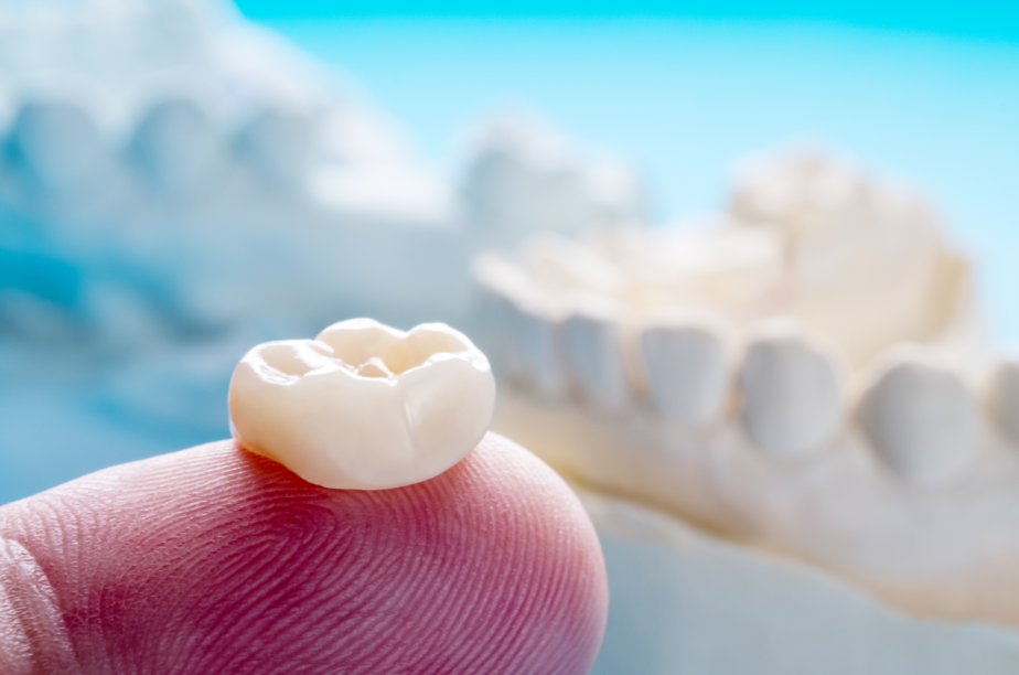 Dental crown on fingertip